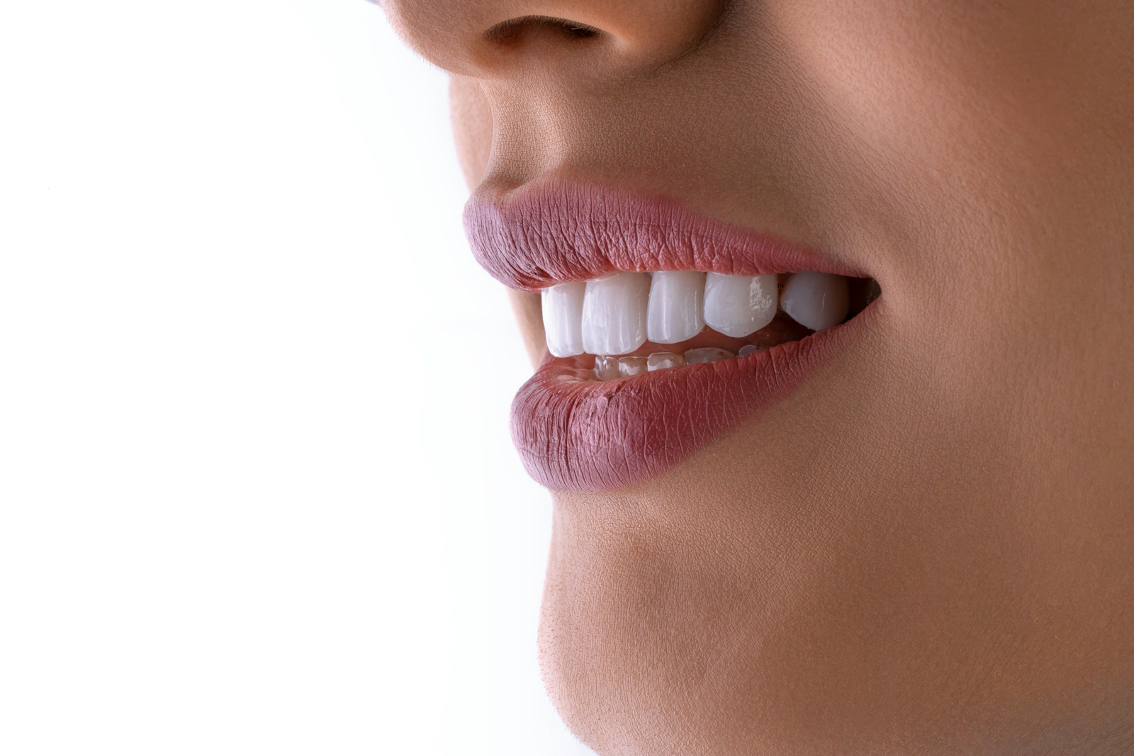 Somos Clinica Dental Bo-K a close up of a woman's mouth with white teeth